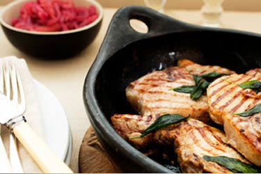 Stewed apples with red onions, grilled pork chops and sage butter