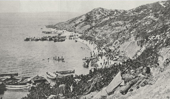 The landing at Gaba Tepe. View of the beach and wounded soldier in the foreground. | 23 September 1915 Weekly News