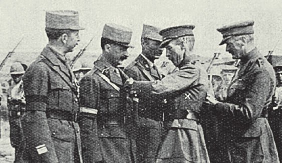 The last act of a commander. General Hamilton decorates French Officers with the Military Cross just before he was replaced.| Weekly News