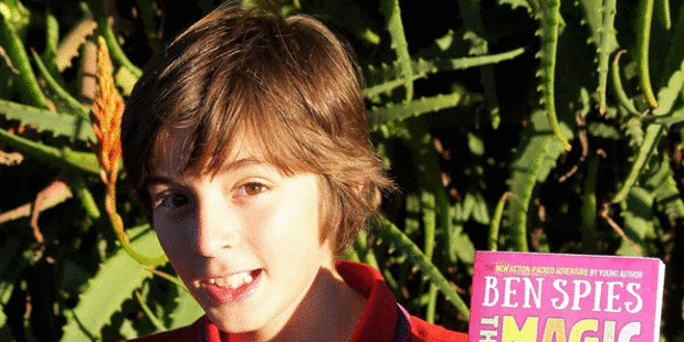 Ben Spies, 11, with his "quirky and authentic" book The Magic Pencil, the second of his two published children's books.