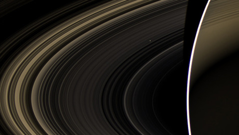 space shot: venus seen through rings of saturn