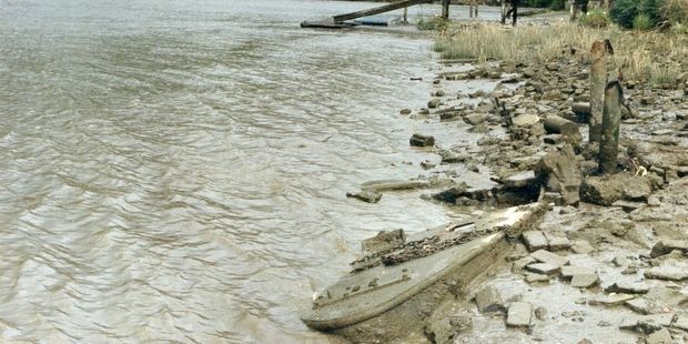 WHERE'S WAIRUA? The bow of the Wairua can just be seen at low tide in this photo from the 1980s. PICTURE: MARK CAMPBELL