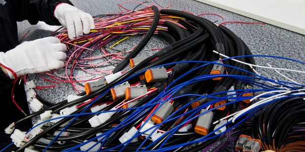Process workers making wiring looms at Fero in Mount Wellington. Photo / Jason Oxenham
