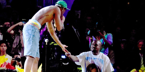 Designer/hip hop artist Tyler the Creator (L) and Kanye West appear at Tyler, the Creator's fashion show for Made LA earlier this year. Kanye's fashion empire is growing quickly. Photo / Getty