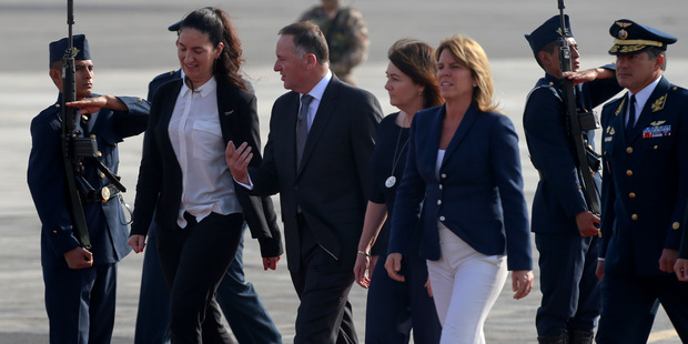 John Key and his wife Bronagh walk the guard of honor upon their arrival to Lima, Peru, to participate in the APEC Summit. Photo / AP