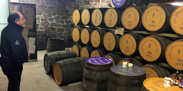 David Thomson surveys the casks of Scotch aging in Annandale's warehouse. Photo / Rodney Jefferson
