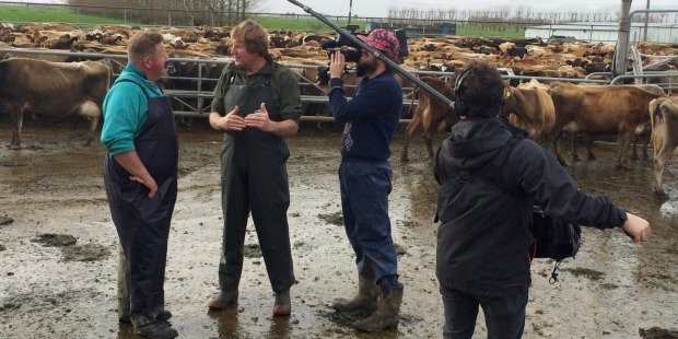 Gavin Flint (left) talks to Cameron Bennett (right) during filming of the Sunday show 'The Price of Milk'. Photo / TVNZ