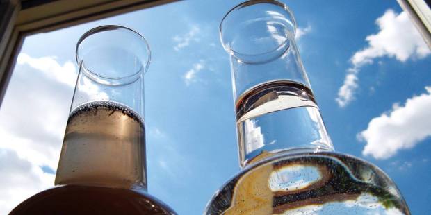 DRINK THIS: Water from a rural water tank before and after it was cleaned.