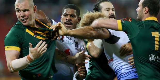 Kangaroo prop David Klemmer (left) comes under attention from Fiji's Tui Kamikamica and Eloni Vunakece after a cheap shot earlier on Jarryd Hayne in Brisbane last night. Photo/Photosport