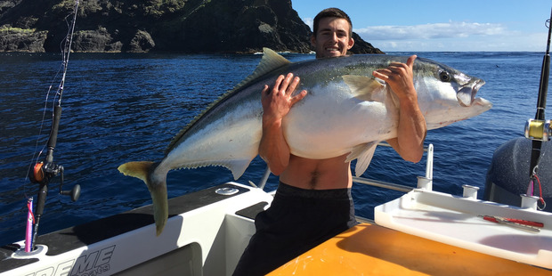 Harrison Bell weighing his 43.5kg kingfish.