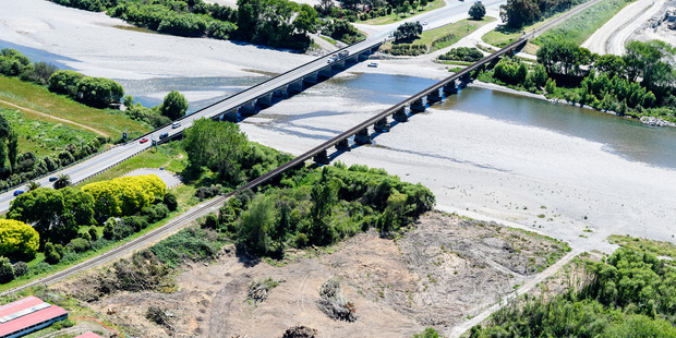Vegetation clearance on south bank of Otaki River where a new bridge will be built.