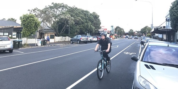 AT WANTS TO GIVE CYCLISTS A BETTER DEAL, ALTHOUGH MAKING THEM RIDE ALONG A LINE OF PARKED CARS IN A SHOPPING VILLAGE HARDLY DOES THAT.