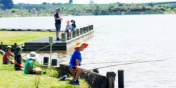 Ngahinapouri School students stake out their preferred fishing spots in the quest for the biggest haul of pest fish from Lake Ngaroto.