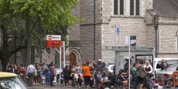 A queue in Hobson St last week for the City Mission food parcels. Photo / NZHERALD FOCUS