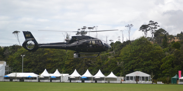 NZ Polo Open organisers bring in the choppers to dry out the field at Clevedon. Photo / Anna Hood