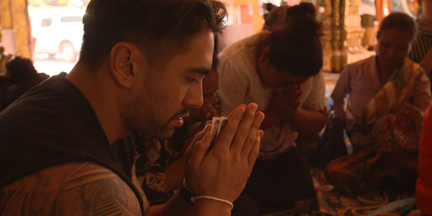 Warriors' star Shaun Johnson visits a temple in Laos. Picture / Supplied