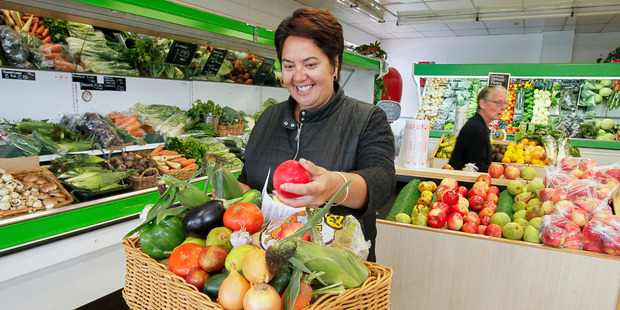 Rebecca Patterson sells and delivers Buck's Greengrocers $20 fruit and vegetable boxes.
