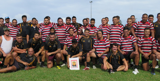 Te Rarawa seniors and the Invitation XV players band together at the end of the annual Rikki Nathan Memorial match at Ahipara on Saturday afternoon. A photo of Rikki Nathan is sitting front and centre.