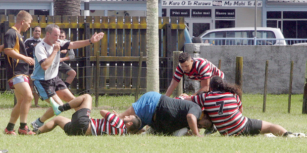 John Hammond signals the Invitation XV's only try after Thomas Rogers crashed through the Te Rarawa defence.