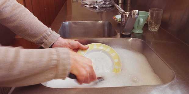 Some Aucklanders are being forced to boil the jug if they want to wash their dishes, as Vector works to restore hot water to 400 homes after last week's storm. Photo / File