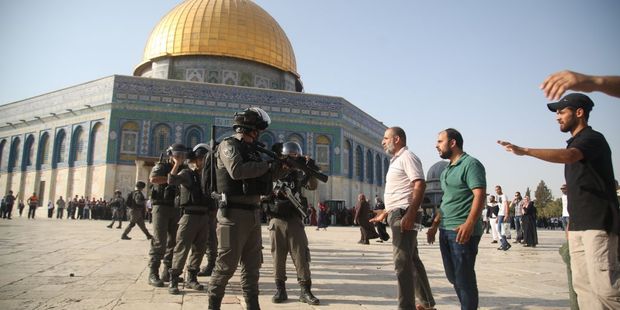 Israeli security forces hold position as they stand guard in front of the Dome of the Rock in the Haram al-Sharif compound in the old city of Jerusalem. Photo / Getty Images