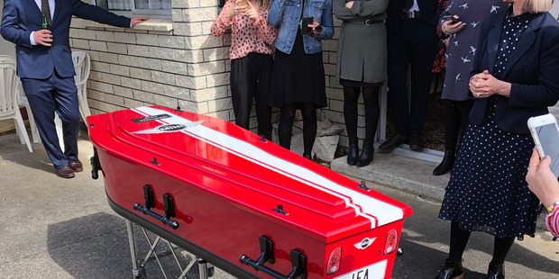 John Alexander is sent off in a coffin painted in the colours of his beloved Mini.