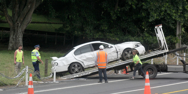 Waipa Towing pulls the crashed Falcon XR8 out of the paddock on Ohaupo Rd.