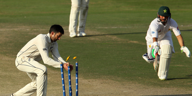 Will Somerville runs out a comically shoeless Yasir Shah. Photo / Photosport