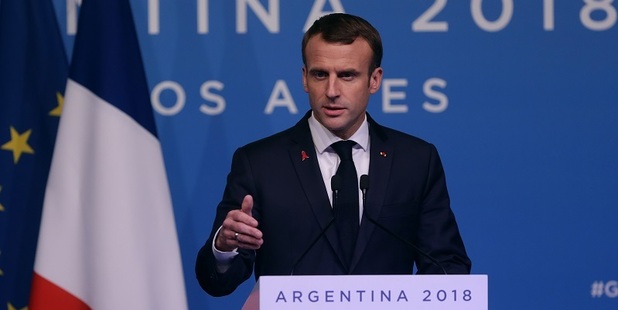 Emmanuel Macron yesterday scrapped a fuel tax rise amid fears of new violence. Photo / AP