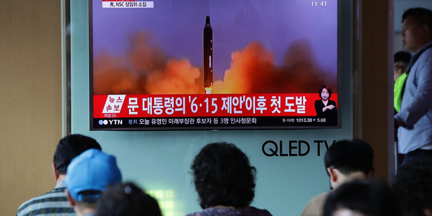 People watch a television broadcast reporting the North Korean missile launch at the Seoul Railway Station on July 4, 2017 in Seoul. Photo / Getty Images