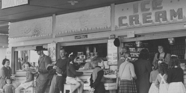 Customers buying ice-cream at a shop at Waihi Beach. Photo / File