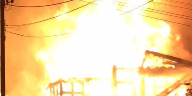 A house fire rages on the corner of Wellington Rd and Beach Rd Paekakariki. Photo: Marcel Hamann