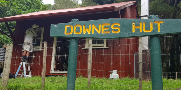 Bob Anderson at work on Downes Hut.