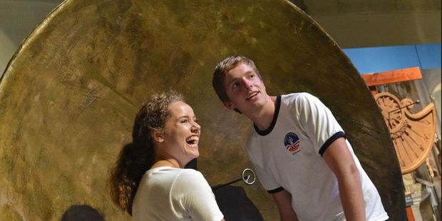 Visitors engage with the Parabolic Mirror for Sound interactive at the 2016 world premiere of Eureka: The Inventions of Archimedes at the U.S. Space and Rocket Center. Photo / Supplied