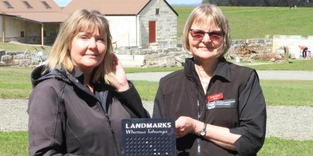 Keren Mackay (left) and Anne Sutherland celebrate the official recognition of the Landmarks Whenua Tohunga status of Totara Estate, near Oamaru, yesterday. Photo / Hamish MacLean