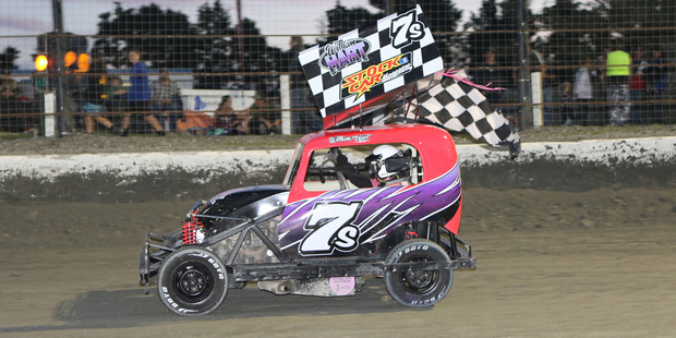 William Hart takes to the track in his pink car.