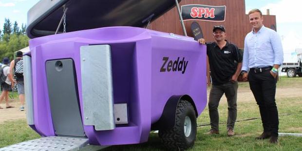 Zeddy team members Shane Parlato and Pearse McGoughan show off the Zeddy 1250 Dry Feeder, which won the Southern Rural Life Innovation Award at the Southern Field Days recently. Photo: Nicole Sharp