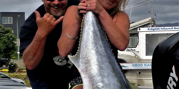 Lee Claxton, with husband Reece Claxton, with a kingfish caught off Kāpiti Island.