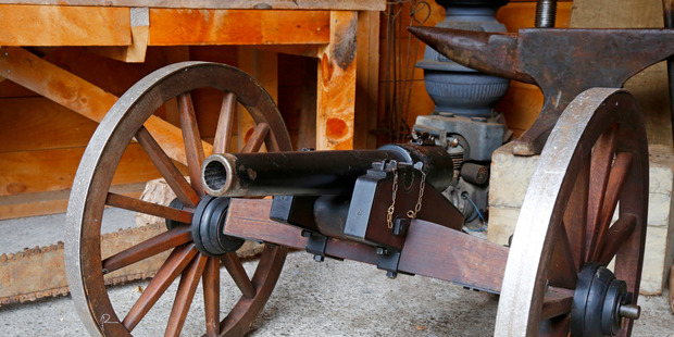 Pancho treats guests to a blast from the antique cannon at Mellonsfolly.
Photo/Bevan Conley